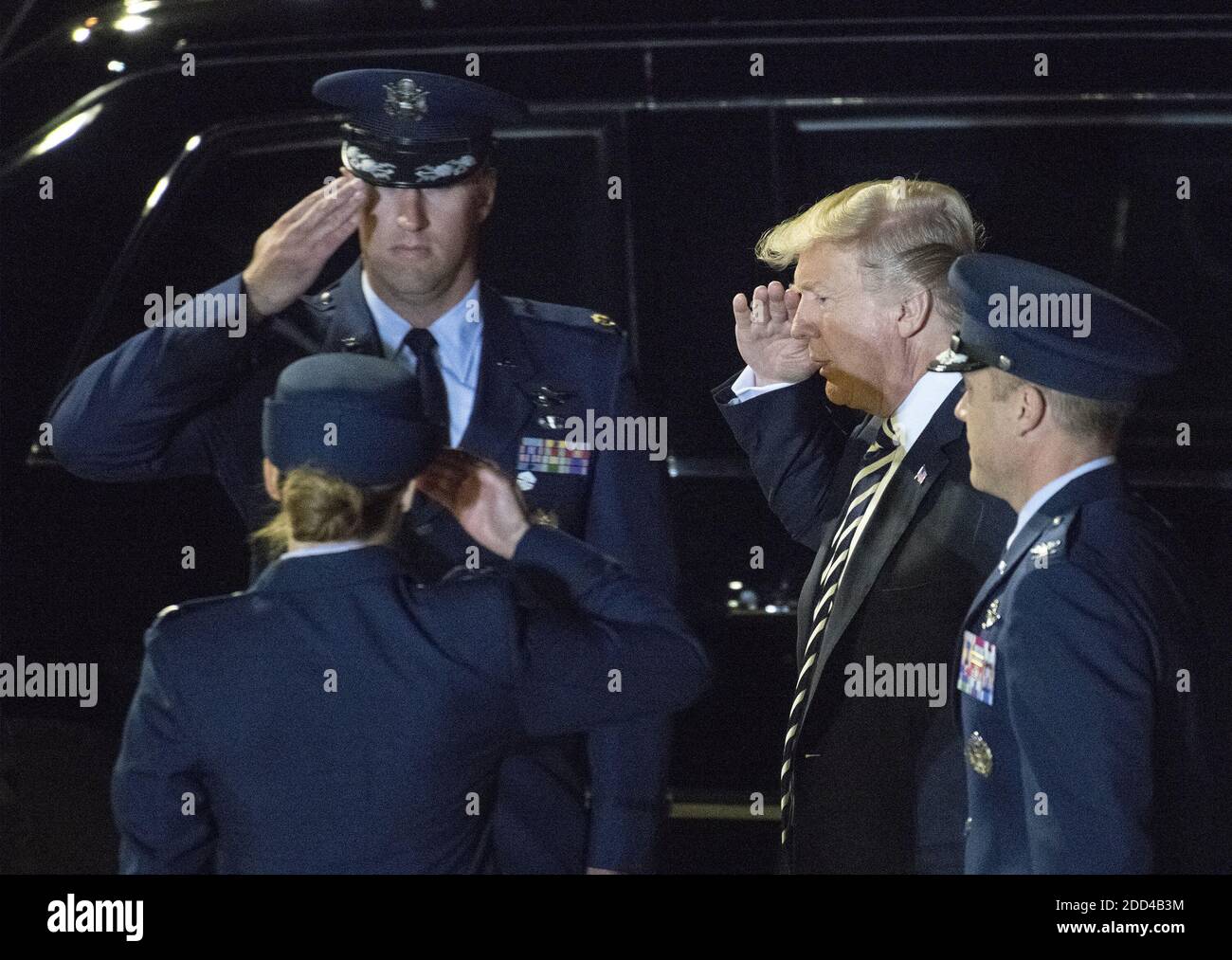 United States President Donald J. Trump exchanges salutes with officers as he prepares to welcome Kim Dong Chul, Kim Hak Song and Tony Kim back to the US at Joint Base Andrews in Maryland on Thursday, May 10, 2018. The three men were imprisoned in North Korea for periods ranging from one and two years. They were released to US Secretary of State Mike Pompeo as a good-will gesture in the lead-up to the talks between President Trump and North Korean leader Kim Jong Un. Photo by Ron Sachs/CNP/ABACAPRESS.COM Stock Photo