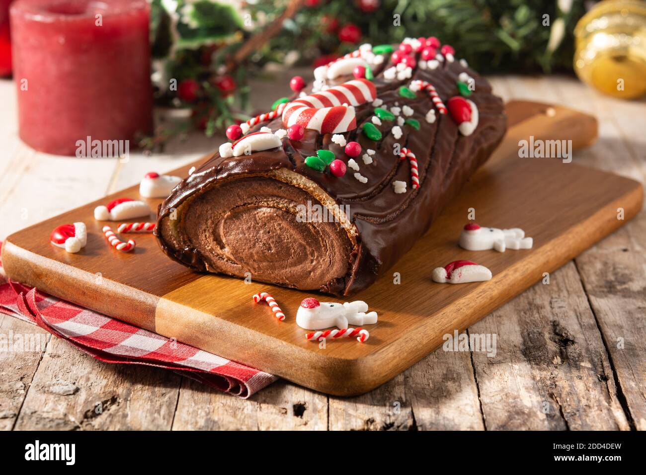 Three different patisserie Buches de Noel in dark and light chocolate  decorated with fruit and Christmas ornaments Stock Photo - Alamy