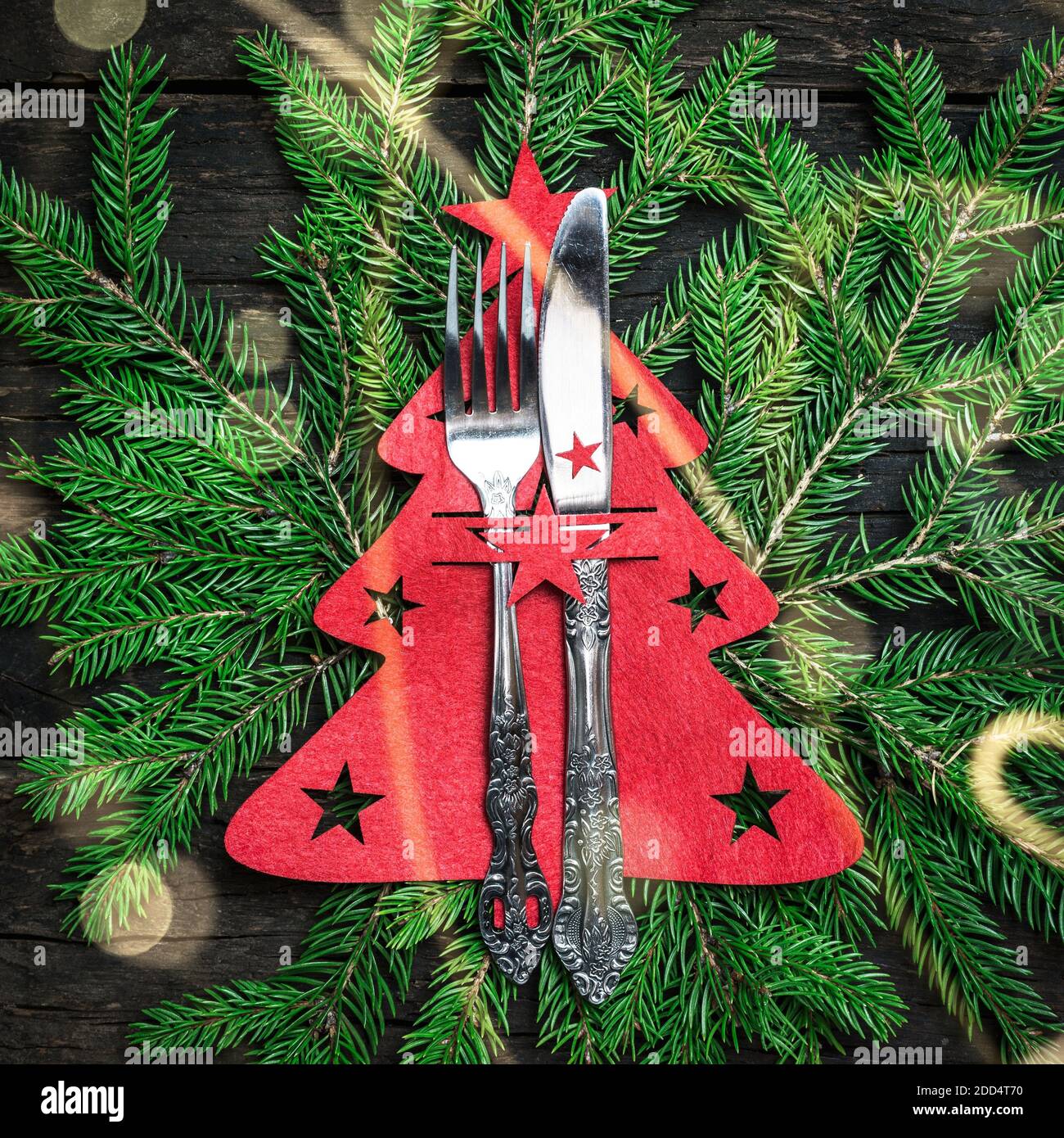Christmas table place setting with Christmas decorations, top view with copy space. Winter Holidays background. Stock Photo