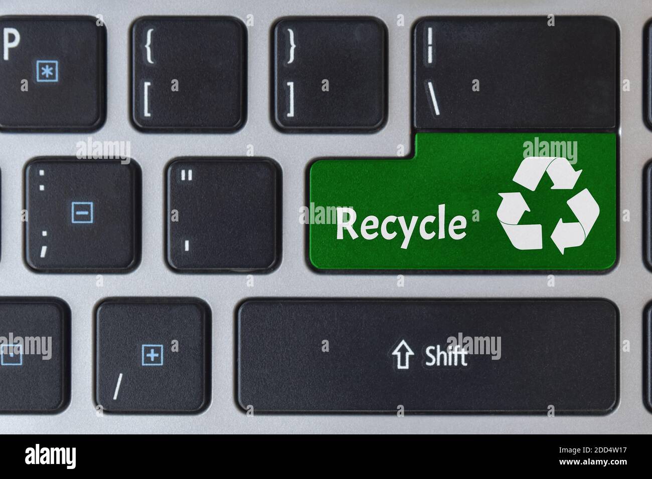 Save of environment concept. Logo recycle icon symbol on laptop keyboard. Stock Photo