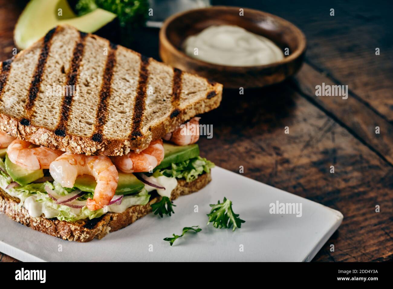 Delicious seafood sandwich on toasted wholegrain brown bread with