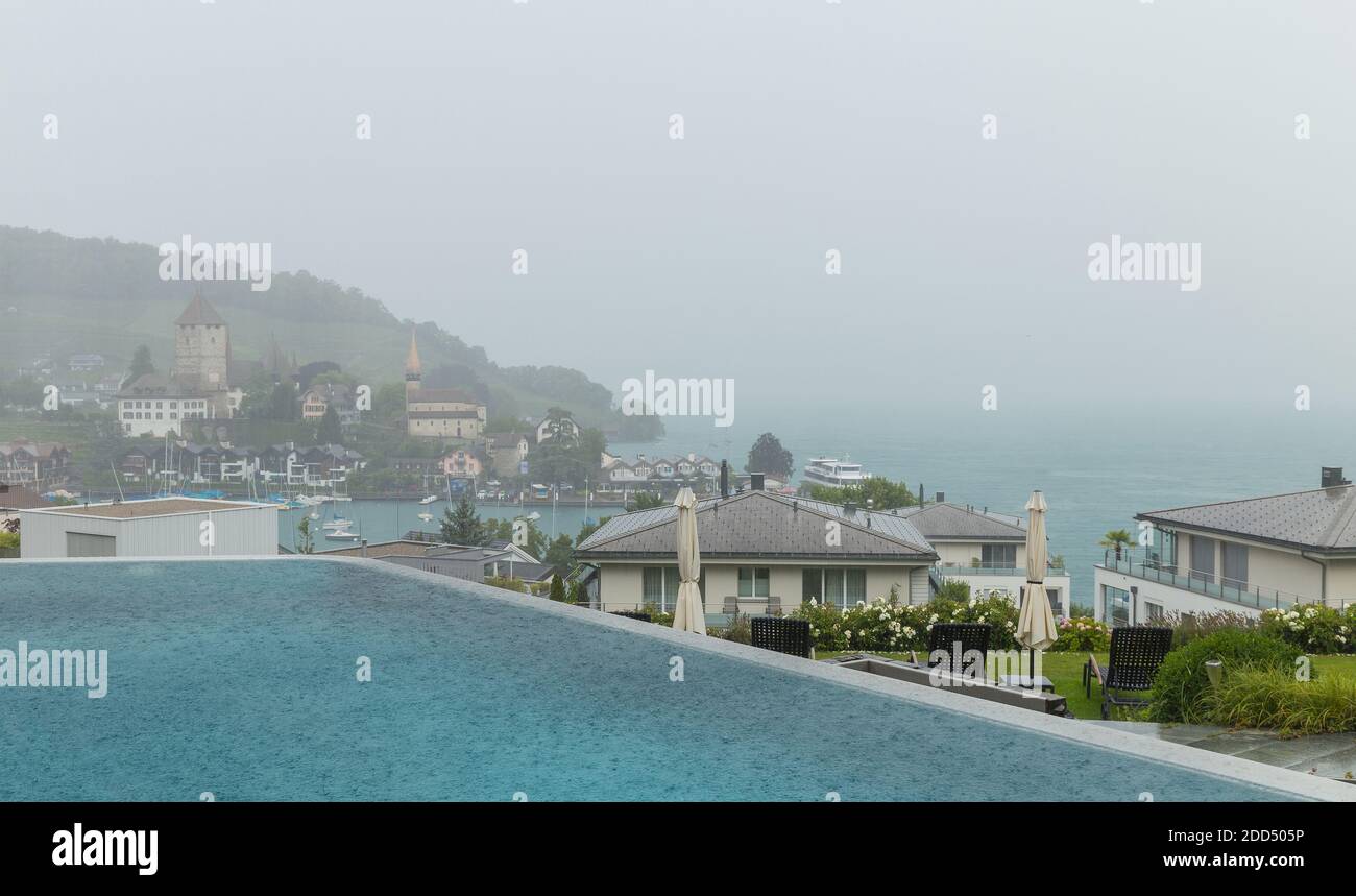 Beautiful view on small city Spiez at the raining day, near the Thun lake and part of pool in spa centar. Canton Bern, Switzerland Stock Photo