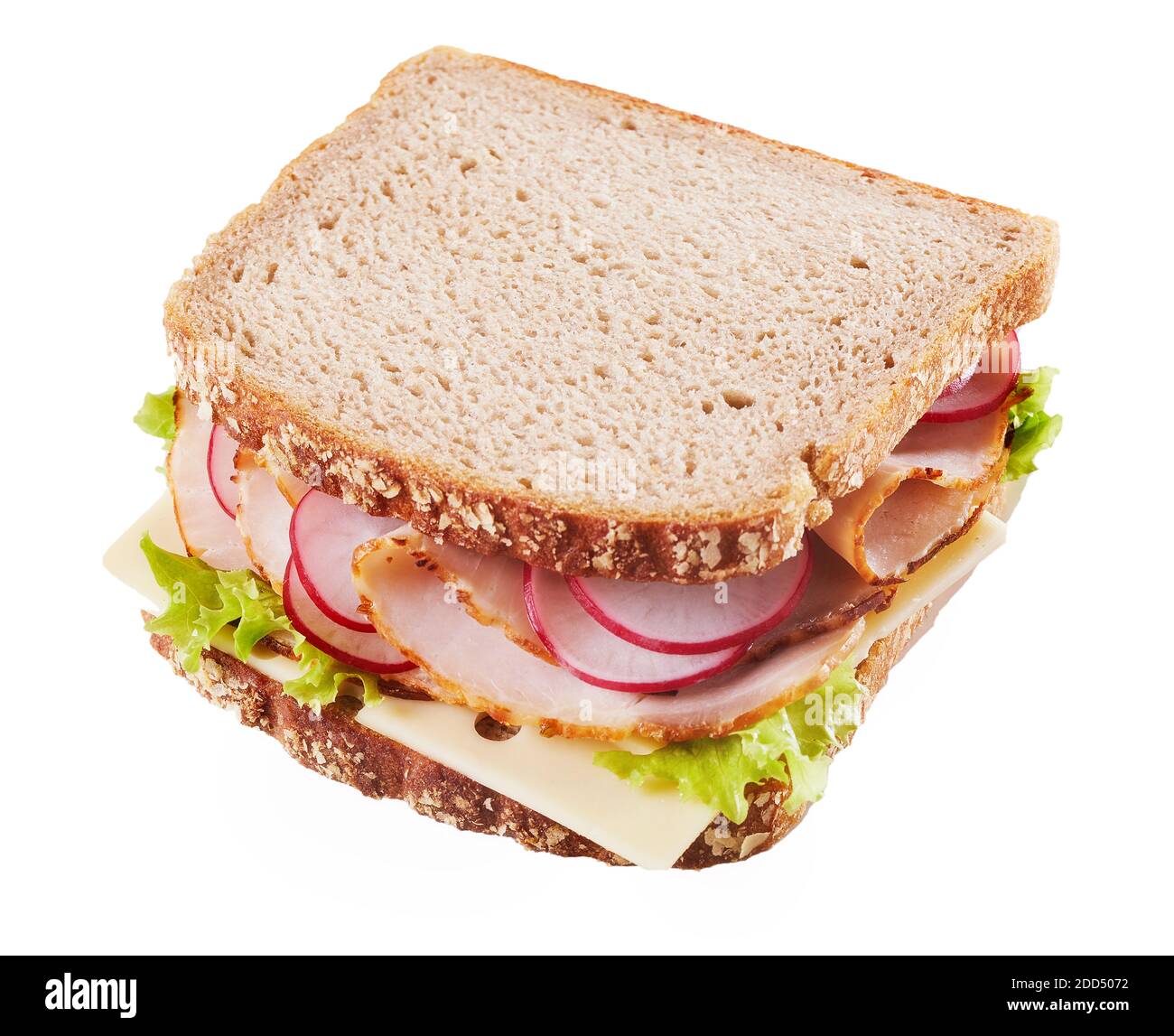 Ham and cheese sandwich with sliced fresh radishes and lettuce on healthy wholegrain brown bread isolated on white Stock Photo