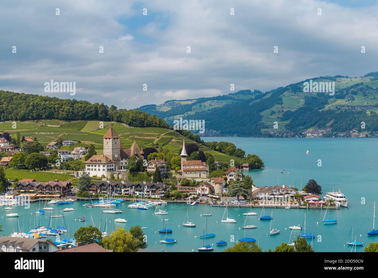 View on beautiful small city, lake Thun, marine and many boats. City of Spiez, canton Bern, Switzerland Stock Photo