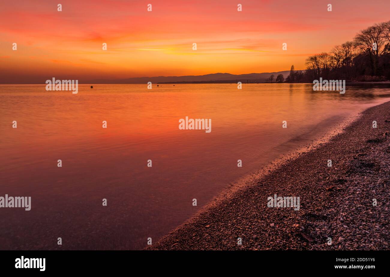 Beautiful colorful sunset sky with clouds over the lake Leman.  Lausanne Switzerlan. Ideal use for background Stock Photo