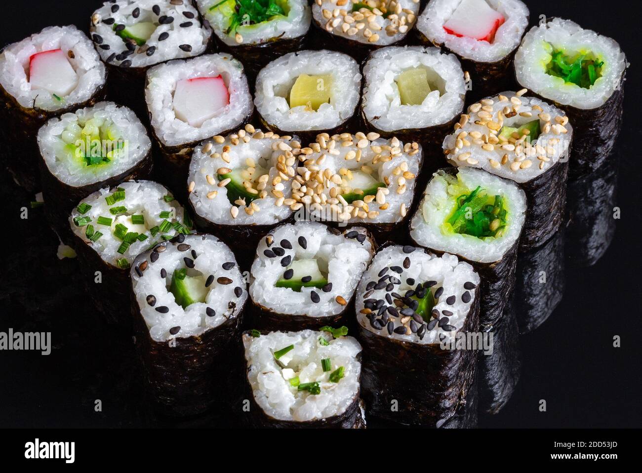 Sushi on a black background with the reflection. Macro photography Stock Photo