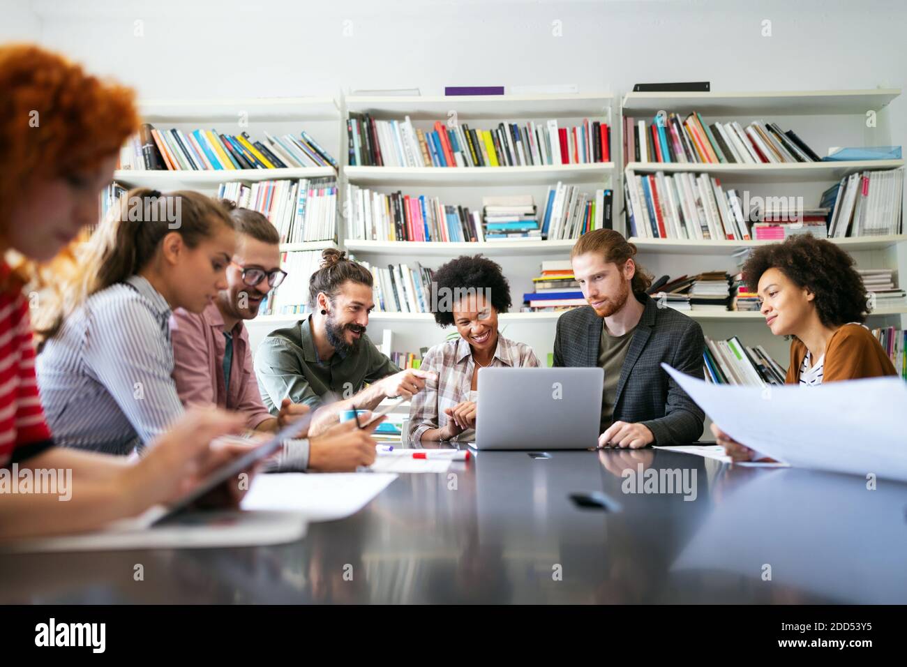 Group of business people collaborating on project in office Stock Photo ...