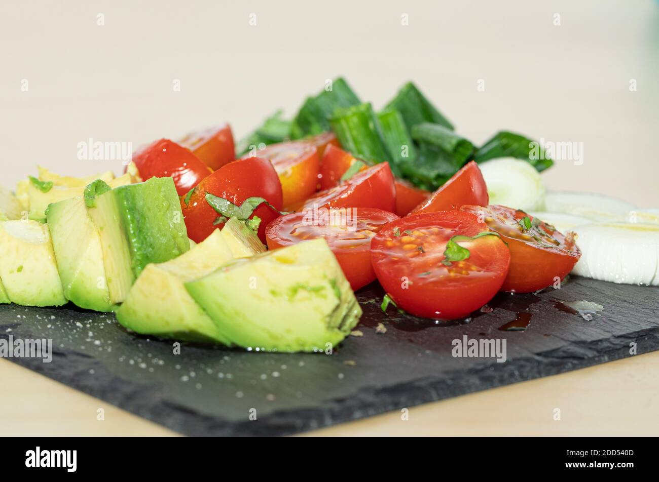 Salad - avocado, spring onion and tomato stock photo Stock Photo