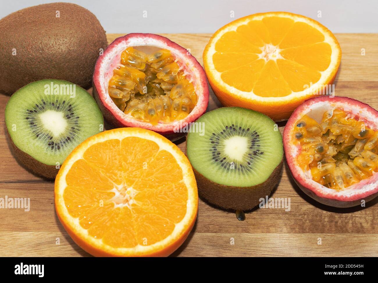 Mixed Fruits On The Wooden Background. Kiwi. Orange. Passion Fruits. Stock Photo