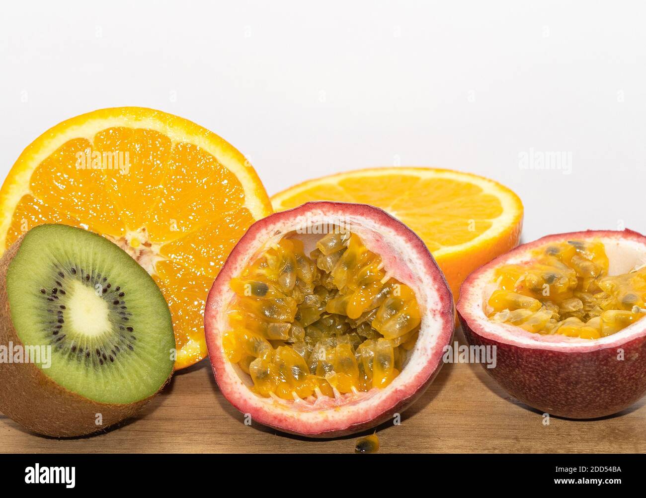 Mixed Fruits On The Wooden Background. Kiwi. Orange. Passion Fruits. Stock Photo