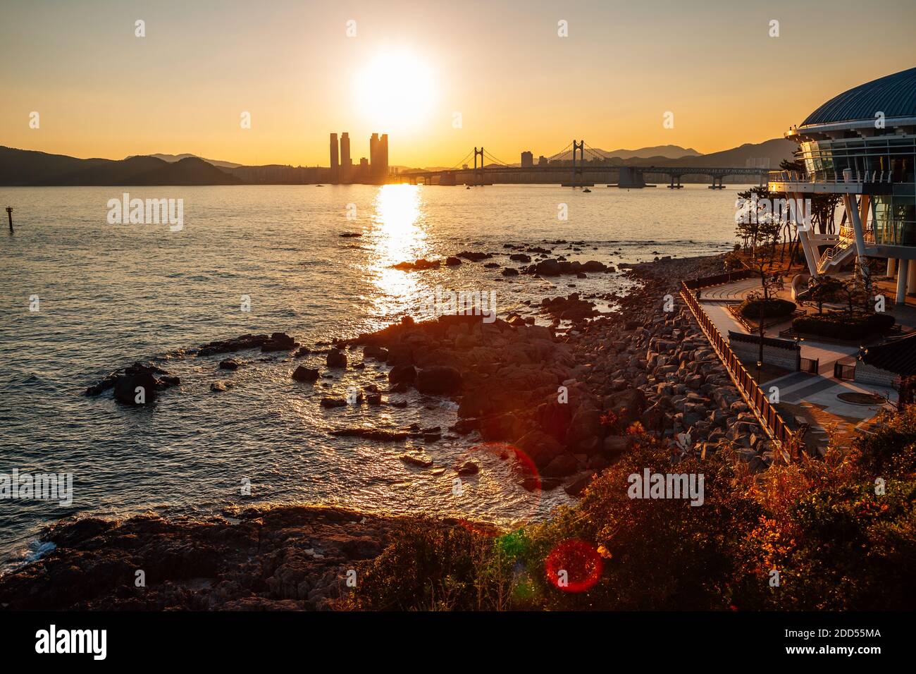 Sunset view of Gwangan bridge and sea at Haeundae Dongbaekseom island in Busan, Korea Stock Photo