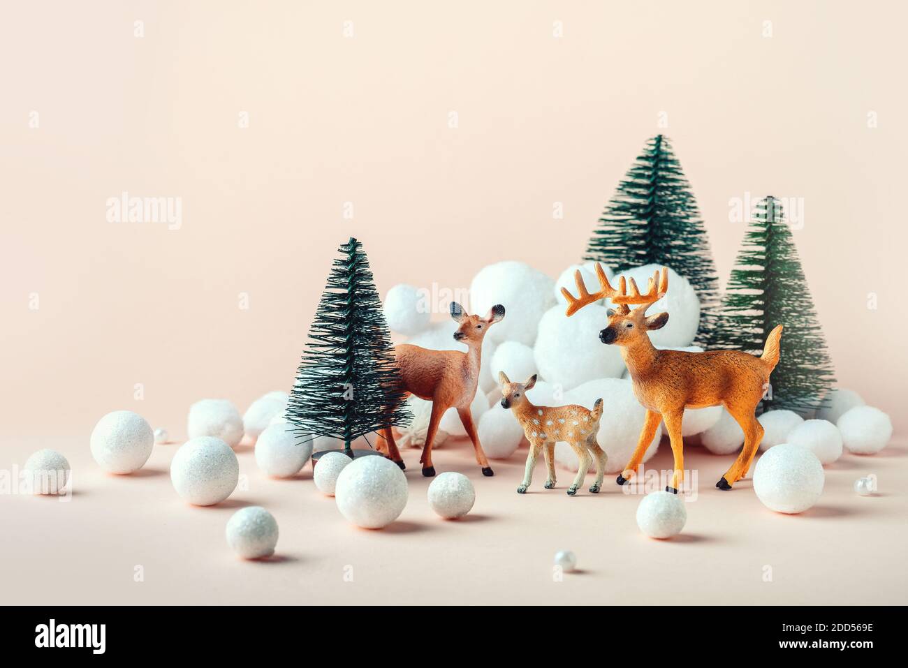 Christmas, winter composition: a family of deer in the winter forest. Happy Christmas and New Years concept. Christmas Eve Stock Photo