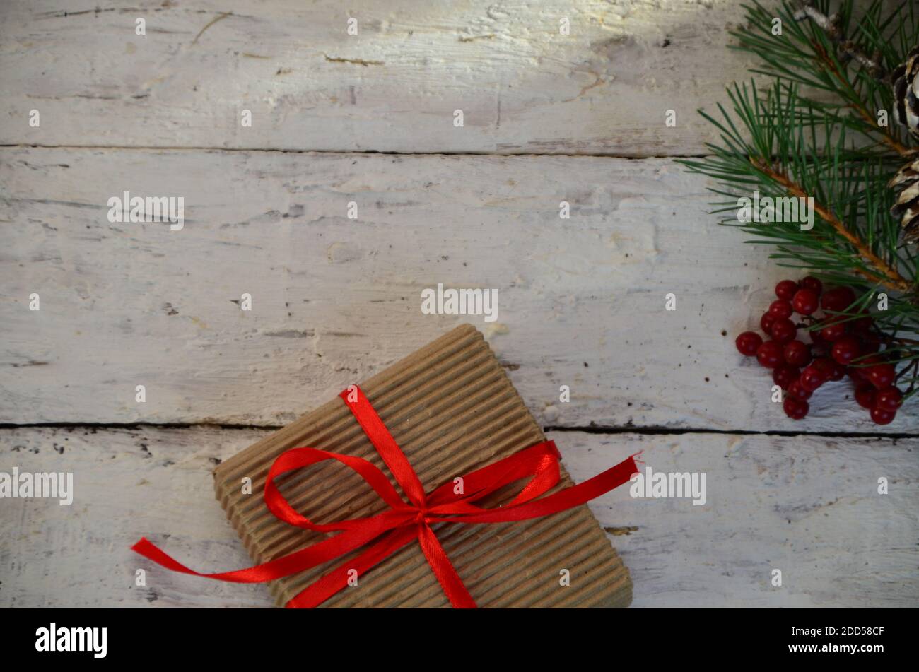 Christmas gift box with decoration. box tied with a red ribbon, a ...
