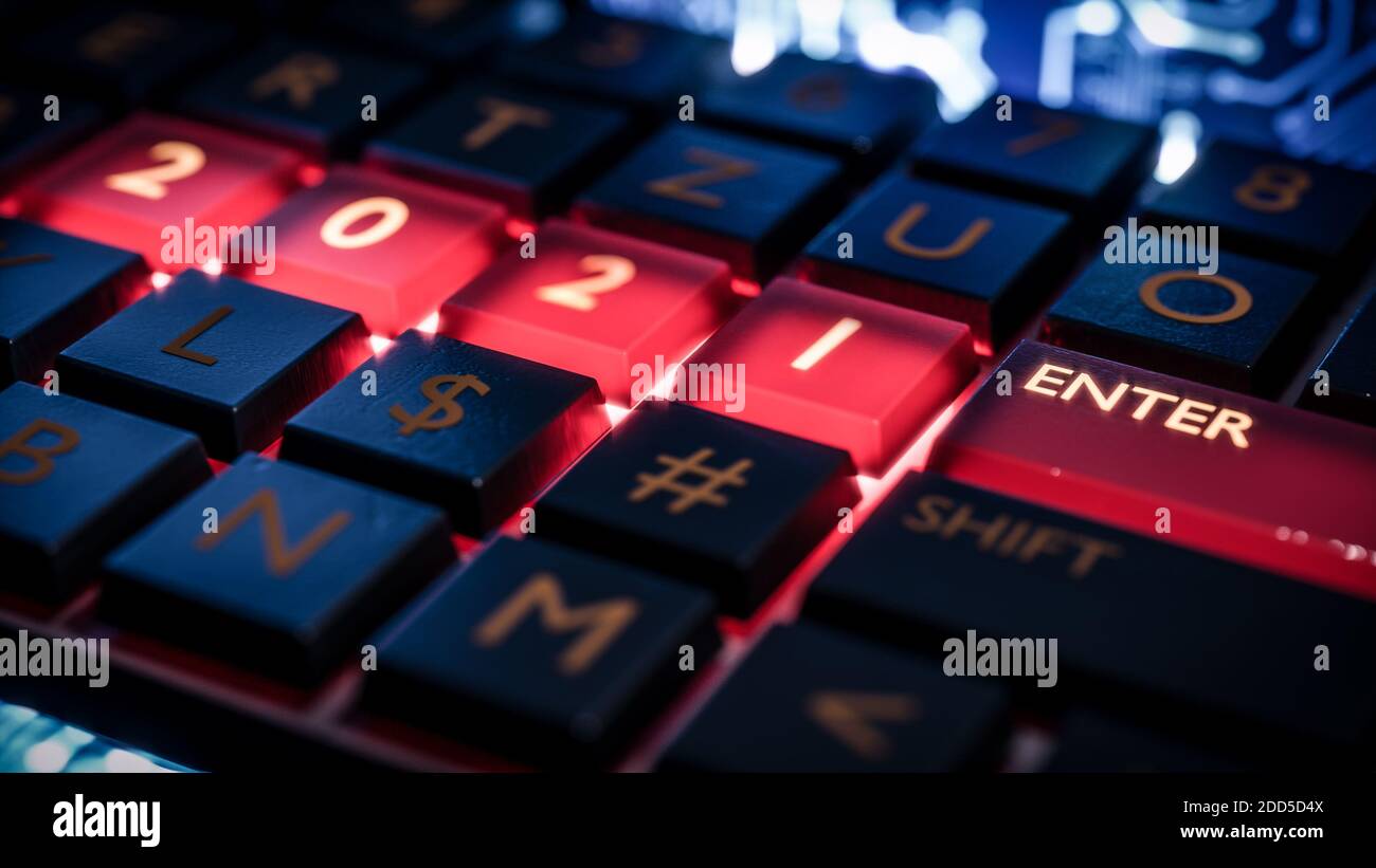 Close up view of keyboard with red light on 2021 number keys and enter key. Technical concept for entrance or start to new year. Happy new year, 2021. Stock Photo