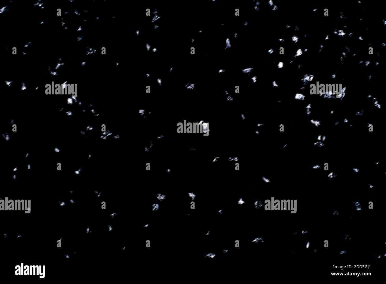 Abstract black background with isolated snowflakes Stock Photo - Alamy