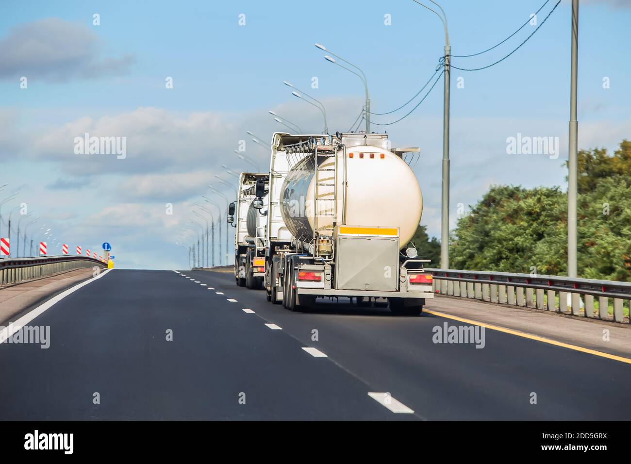 petrol tankers transport fuel along the highway in summer Stock Photo
