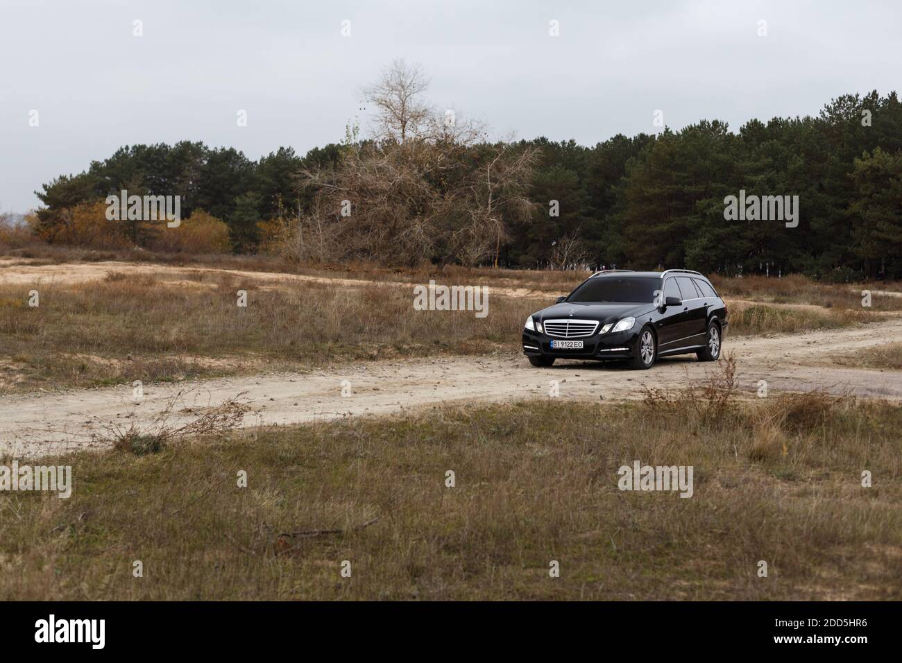 Dnipro, Ukraine - november 21, 2020: Mercedes-Benz E220 CDI 2011 black color in the autumn city near the forest Stock Photo
