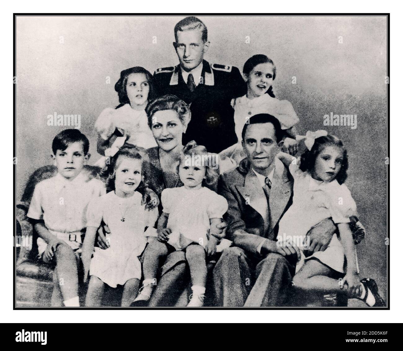 GOEBBELS FAMILY GROUP PHOTOGRAPH 1942 German Nazi politician and minister of propaganda Paul Joseph Goebbels (1897 - 1945) with his wife Magda and their children, Helga, Hildegard, Helmut, Hedwig, Holdine and Heidrun, 1942. Also ‘present’ is Harald Quandt (in uniform), his image subsequently retouched & dropped in to be part of group (Magda Goebbels' son by her first marriage.) With the fall of the Third Reich, Magda and Josef Goebbels poisoned their six children before both committing suicide. Hitlers Propaganda Minister Joseph Goebbels (1897-1945) Stock Photo