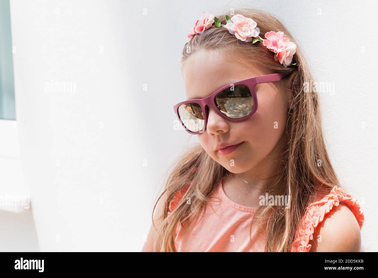 Blond little girl in sunglasses, close-up face portrait Stock Photo