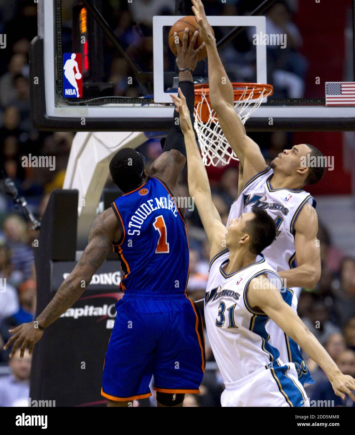 NO FILM, NO VIDEO, NO TV, NO DOCUMENTARY - New York Knicks power forward  Amare Stoudemire (1) is defended by Washington Wizards power forward Yi  Jianlian (31) and center JaVale McGee (34)