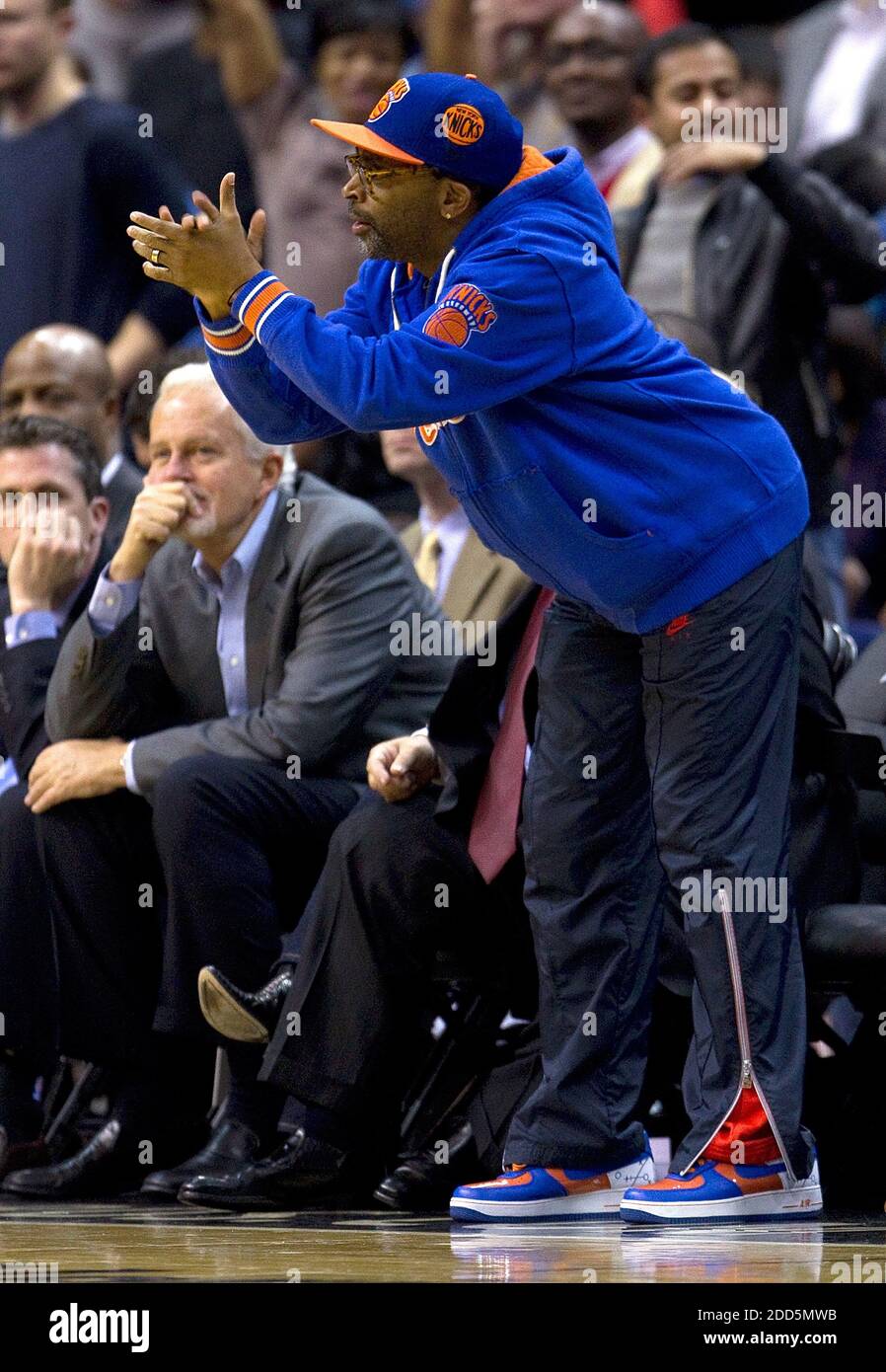 NO FILM, NO VIDEO, NO TV, NO DOCUMENTARY - Movie Director Spike Lee cheers  during the NBA basketball match, Washington Wizards vs New York Knicks at  the Verizon Center in Washington, DC