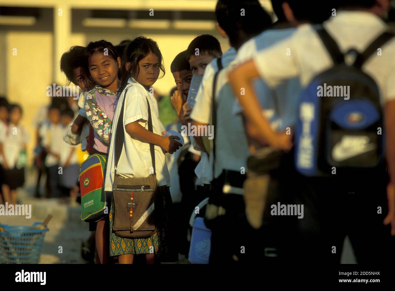 School childern on the way to school in the city of Phnom Penh of ...
