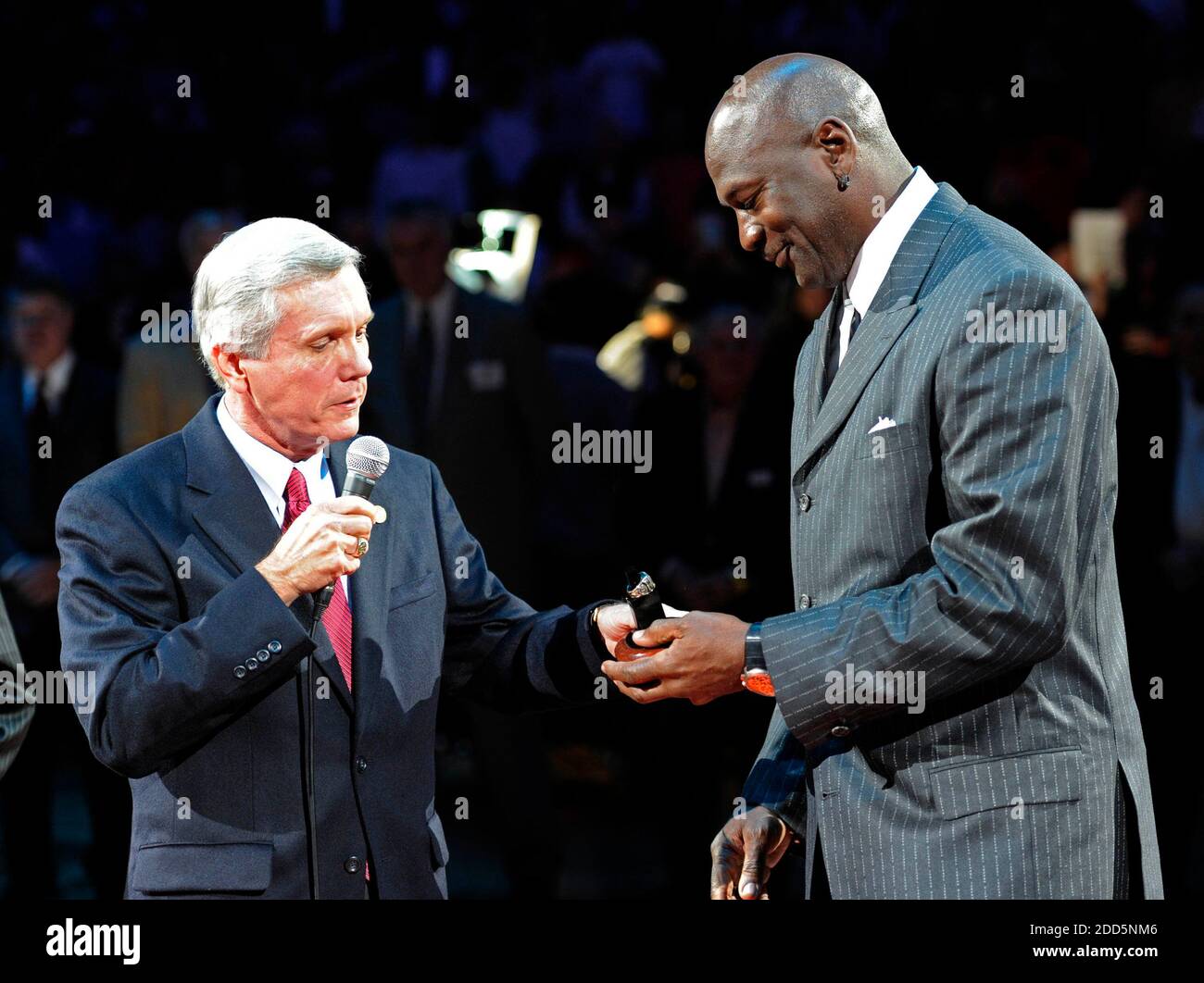 NO FILM, NO VIDEO, NO TV, NO DOCUMENTARY - North Carolina Lt. Gov. Walter Dalton, left, presents Charlotte Bobcats majority owner Michael Jordan with his North Carolina Sports Hall of Fame ring in his induction ceremony in halftime during the NBA Basketball match, Charlotte Bobcats vs Toronto Raptors at the Time Warner Cable Arena in Charlotte, NC, USA on December 14, 2010. The Bobcats defeated Raptors, 97-91. Photo by David T. Foster III/Charlotte Observer/MCT/ABACAPRESS.COM Stock Photo