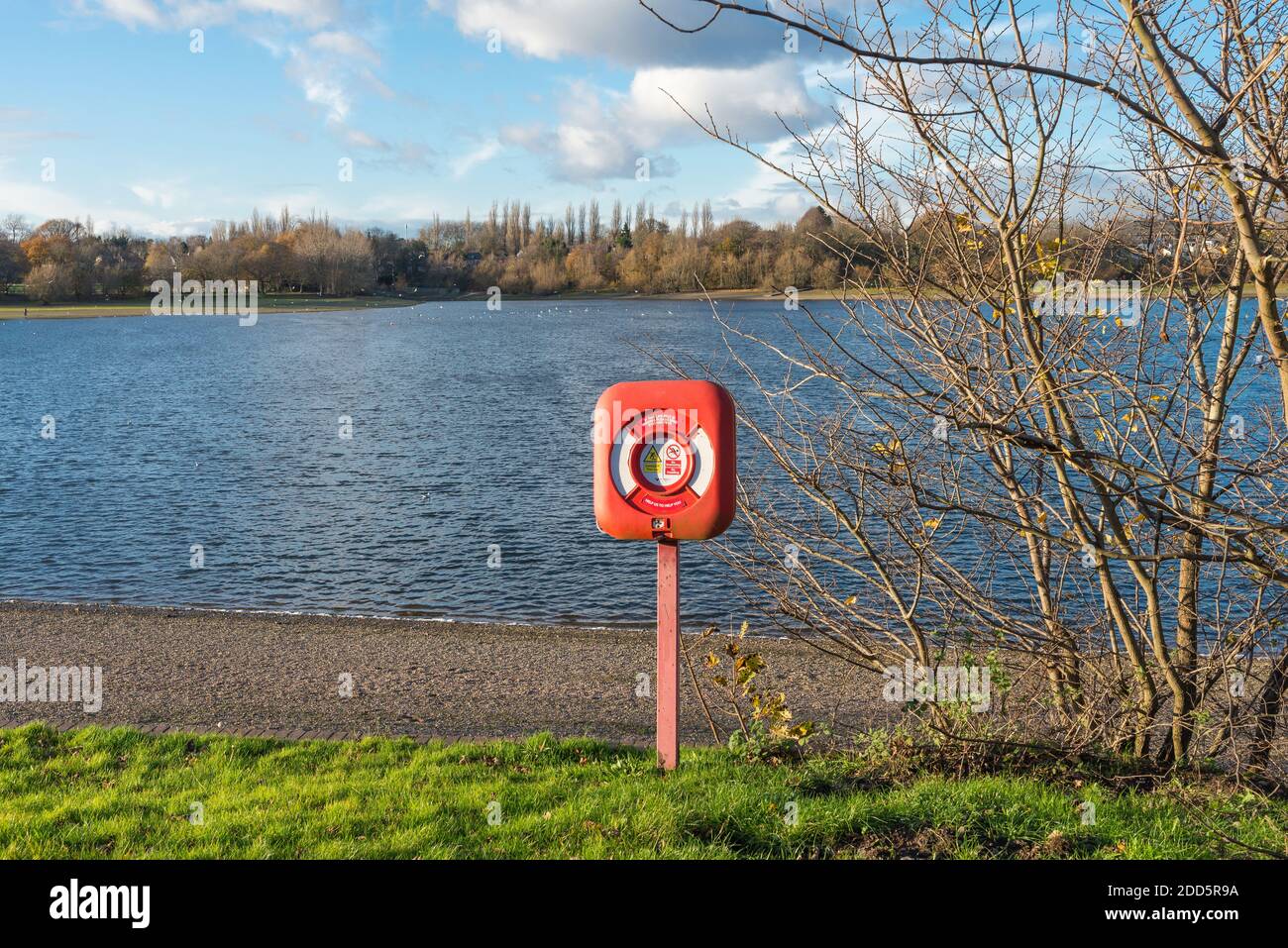Life buoy beside Edgbaston reservoir which is a feeder reservoir for the canal network in Birmingham, UK Stock Photo