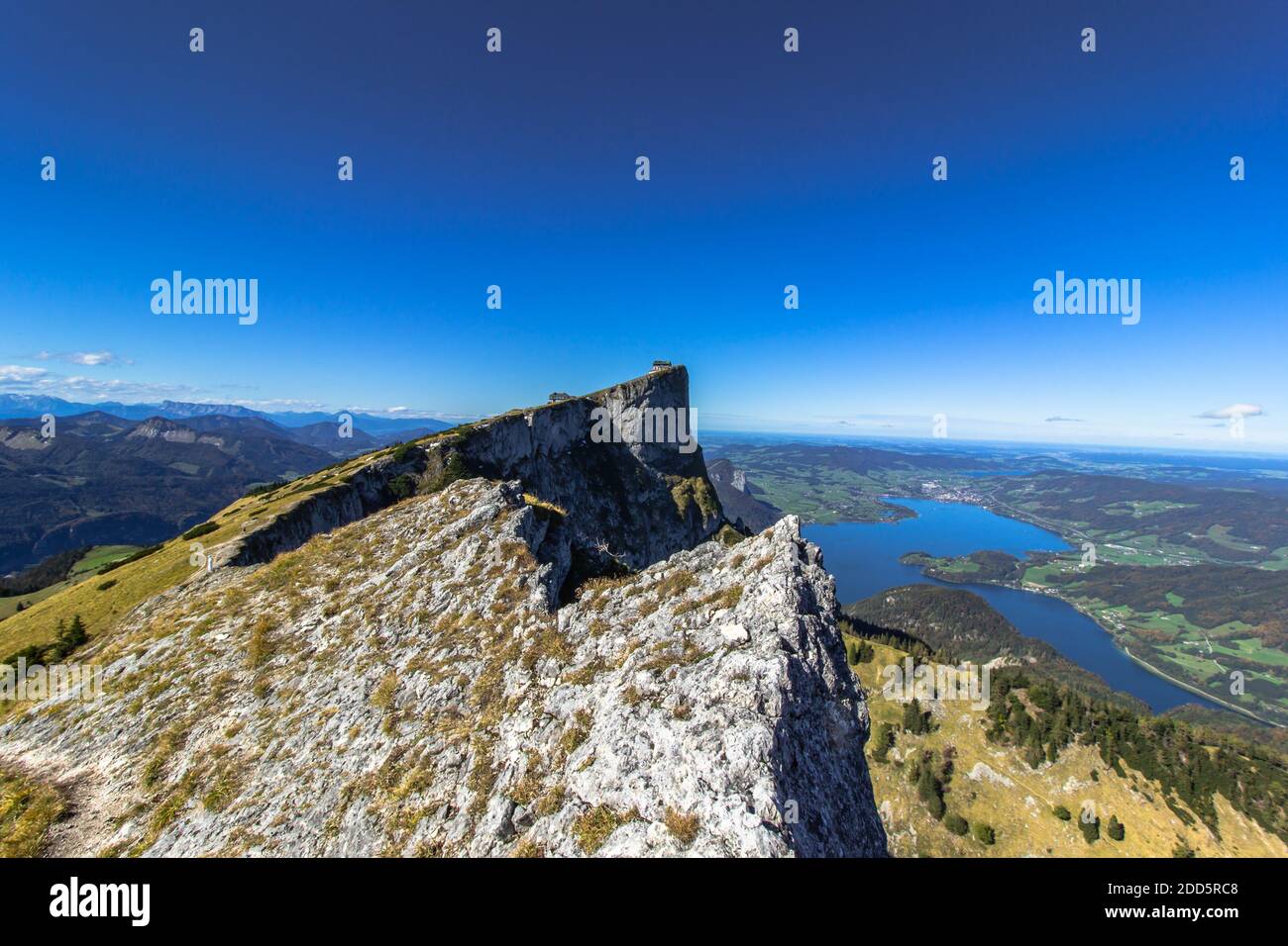 View of lake Mondsee from top of Schafberg,Austria,Salzkammergut region.Blue sky, Alps mountains,Salzburg, nearby Wolfgangsee, Attersee.Hiking in Alps Stock Photo