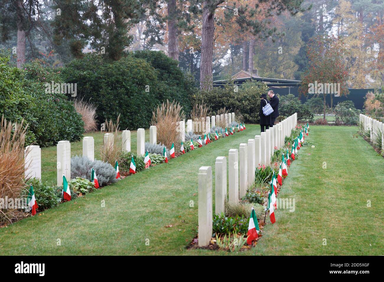 Visitors pay their respects at the graves of  war casualties in the Italian plot, Brookwood. Stock Photo