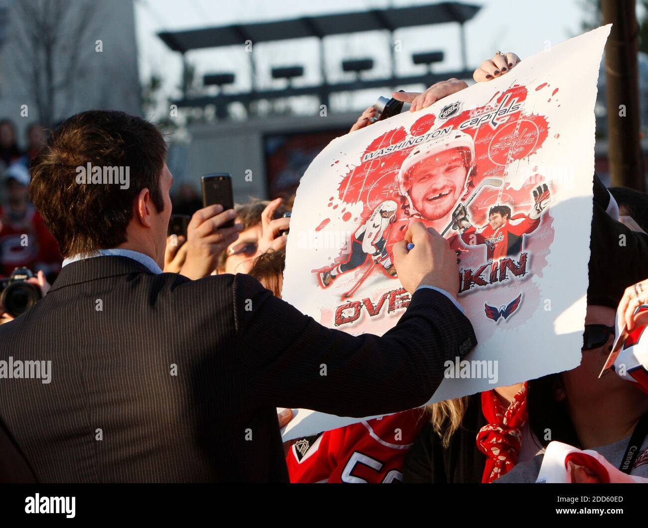 NO FILM, NO VIDEO, NO TV, NO DOCUMENTARY - Alex Ovechkin, of the Washington Capitals, signs autographs as he walks the red carpet upon his arrival to the Skills Competition of the NHL All-Star Game at the RBC Center in Raleigh, North Carolina, USA on January 29, 2011. Photo by Chris Seward/Raleigh News & Observer/MCT/ABACAPRESS.COM Stock Photo