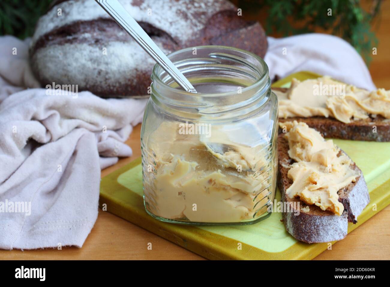 Brunost cheese with black bread and olives Stock Photo