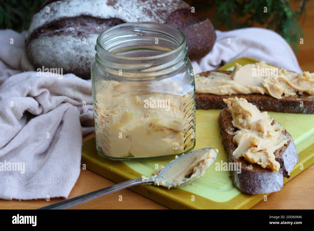Brunost cheese with black bread and olives Stock Photo