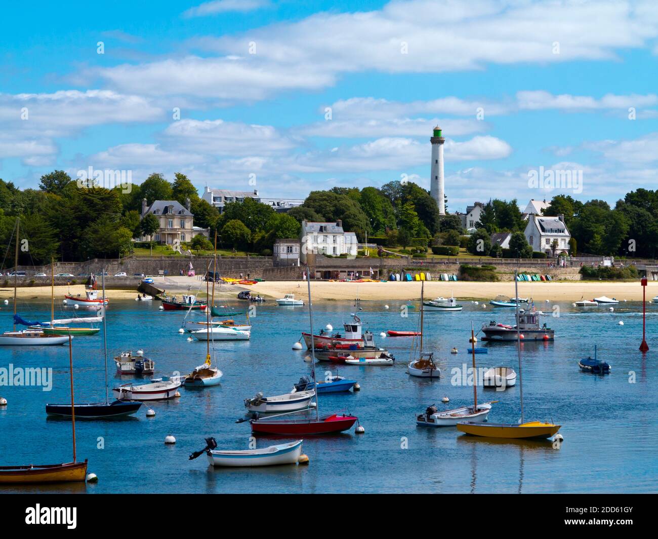 Summer view of Benodet a coastal town on the River Odet estuary in Finistere Brittany north west France with boats moored in the harbour. Stock Photo
