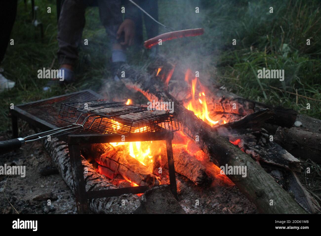 campfire cooking with sausages Stock Photo