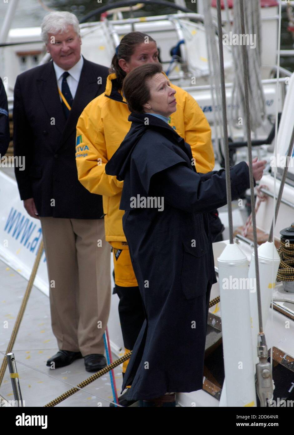 AJAXNETPHOTO. 21 MAY 2006, SOUTHAMPTON, ENGLAND - WRONG-WAY SOLO YACHTSWOMAN ARRIVES - DEE CAFFARI (33) (CENTRE) GIVES HRH PRINCESS ROYAL (PRINCESS ANNE) (FOREGROUND) AND VETERAN ROUND THE WORLD YACHTSMAN CHAY BLYTH (LEFT) A GUIDED TOUR OF HER YACHT AFTER SHE ARRIVED AT OCEAN VILLAGE AFTER HER SINGLE HANDED NON-STOP, SIX MONTH, 29,100 MILE EAST TO WEST CIRCUMNAVIGATION.  SHE CROSSED THE OFFICIAL FINISH LINE BETWEEN THE LIZARD AND USHANT (OUISSANT) ON 18 MAY, 178 DAYS AFTER SETTING OUT FROM PORTSMOUTH IN THE 71FT CUTTER AVIVA. HRH THE PRINCESS ROYAL, VETERAN YACHTSMAN SIR CHAY BLYTH AND M/S CAF Stock Photo