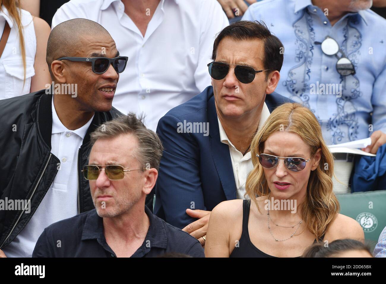 Actor Clive Owen, Actor Tim Roth and his wife Nikki Butler attend the Men Final of the 2018 French Open - Day Fithteen at Roland Garros on June 10, 2018 in Paris, France. Photo by Laurent Zabulon/ABACAPRESS.COM Stock Photo