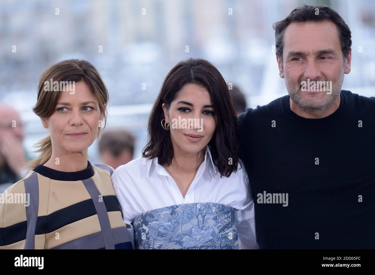 Marina Fois, Leila Bekhti and Gilles Lellouche posing at the Le Grand