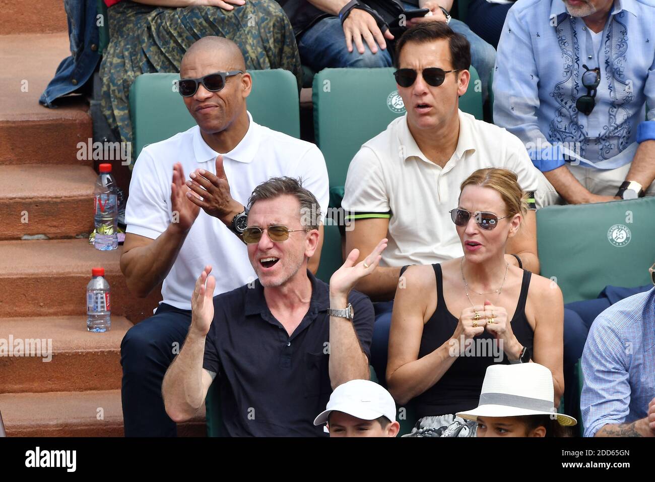 Actor Clive Owen, Actor Tim Roth and his wife Nikki Butler attend the Men Final of the 2018 French Open - Day Fithteen at Roland Garros on June 10, 2018 in Paris, France. Photo by Laurent Zabulon/ABACAPRESS.COM Stock Photo