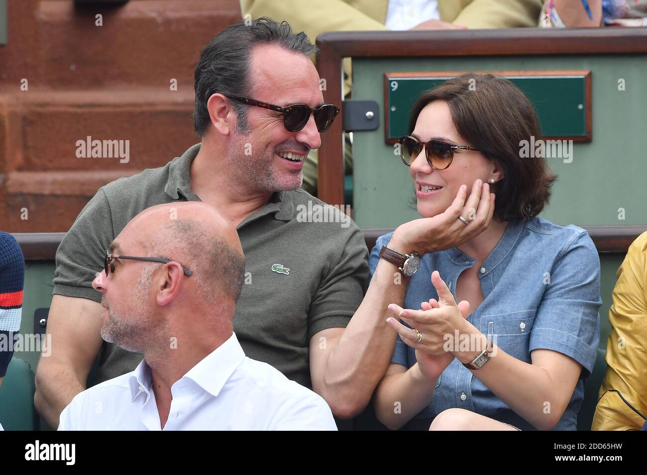 Actor Jean Dujardin and his wife Nathalie Pechalat attend the Men Final of  the 2018 French Open - Day Fithteen at Roland Garros on June 10, 2018 in  Paris, France. Photo by