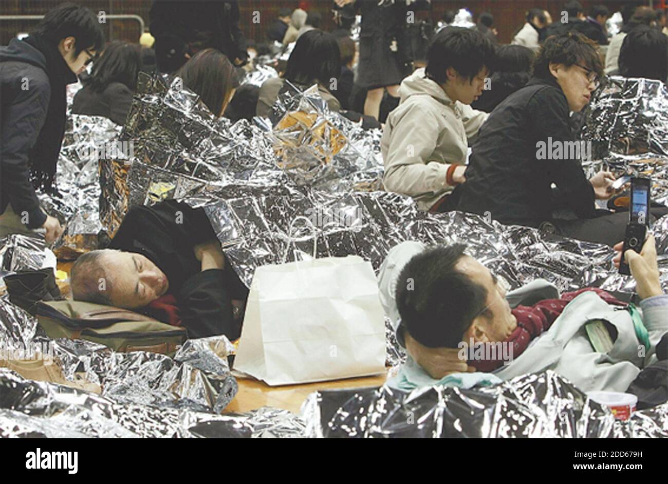 NO FILM, NO VIDEO, NO TV, NO DOCUMENTARY - Unable to find a way home following a devastating 8.9 earthquake, people stay in a gymnasium at Aoyama Gakuin University in Shibuya Ward, Tokyo, Japan on Friday, March 11, 2011. Photo by Yomiuri Shimbun/MCT/ABACAPRESS.COM Stock Photo