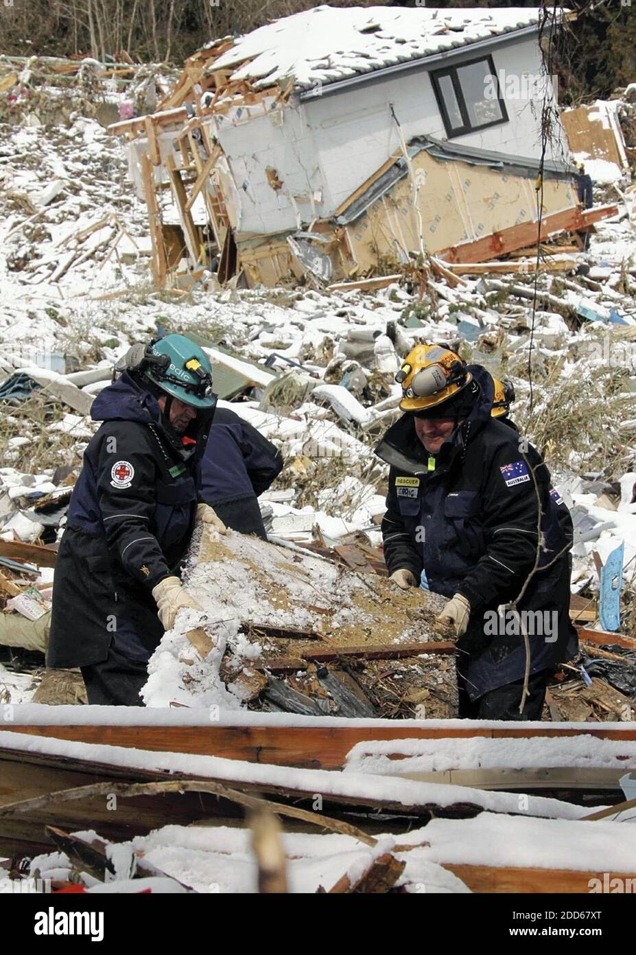 NO FILM, NO VIDEO, NO TV, NO DOCUMENTARY - Australian rescue workers search for missing people in Minami-Sanrikucho, Miyagi Prefecture, in Japan, on March 17, 2011. Photo by Yomiuri Shumbun/MCT/ABACAPRESS.COM Stock Photo