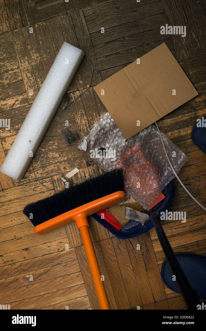 sweeping a dirty and dusty floor, overhead vertical image Stock Photo