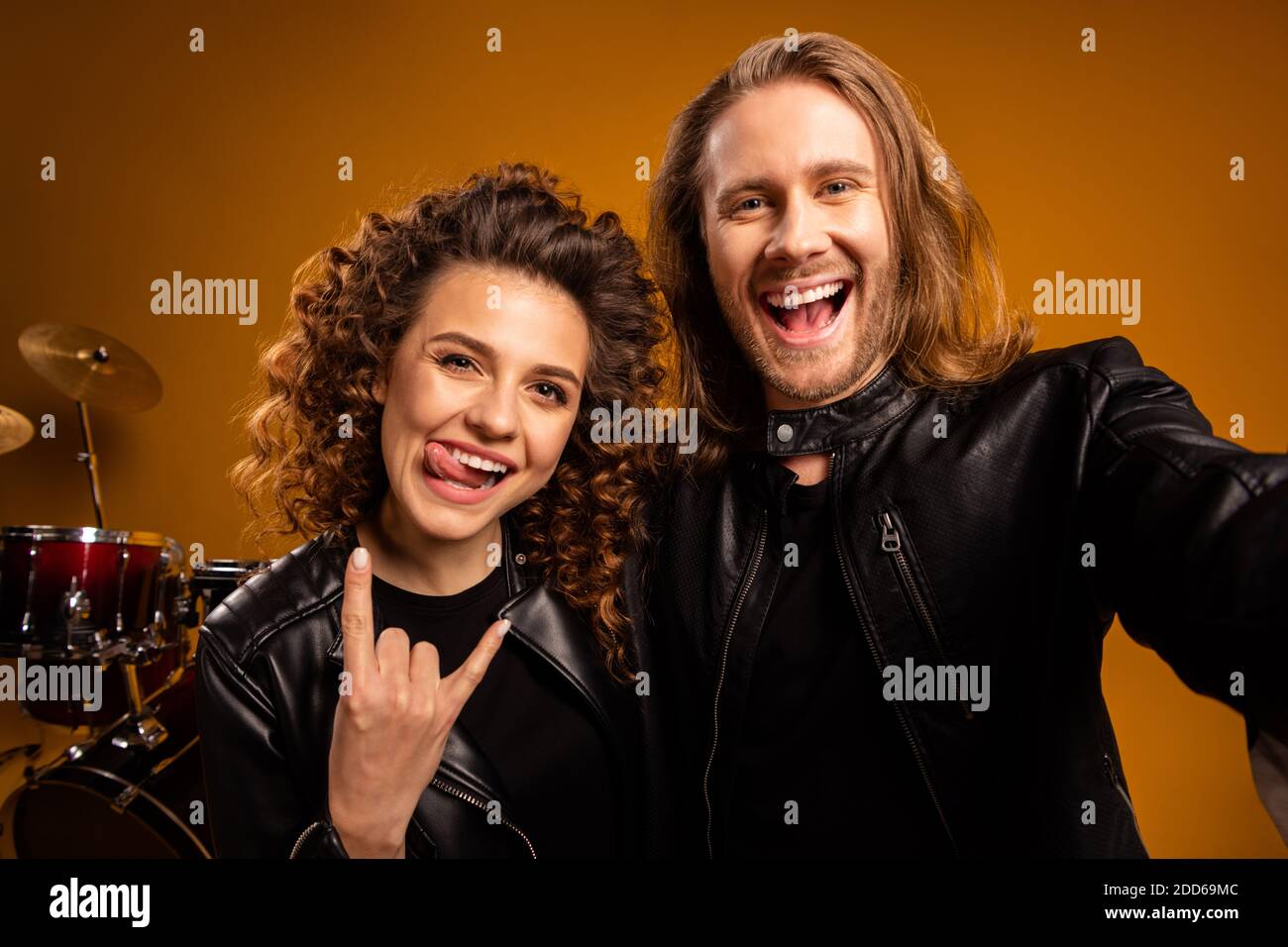 Closeup photo of rock band cool guy crazy attractive redhair girl famous popular song showing