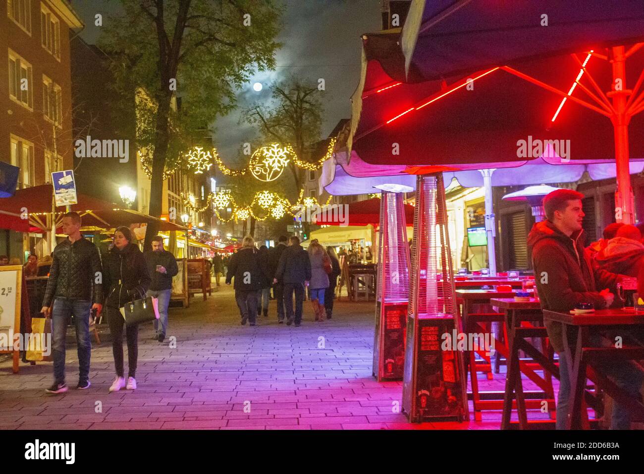 11/296/2015  Dusseldorf , Germany.  Night view on street in Dusseldorf People walking. Fool Moon in sky Stock Photo