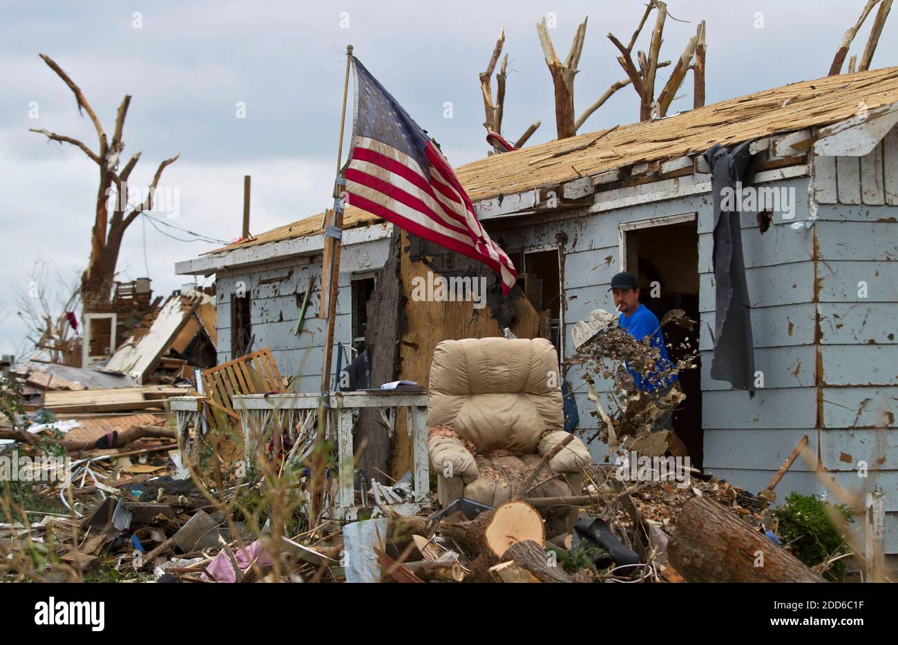 NO FILM, NO VIDEO, NO TV, NO DOCUMENTARY - Kenji Numata shoveled out debris from a home in Joplin, Missouri, on Thursday, May 26, 2011, following the F5 tornado that swept through the city's central section on Sunday. Photo by David Eulitt/Kansas City Star/MCT/ABACAPRESS.COM Stock Photo