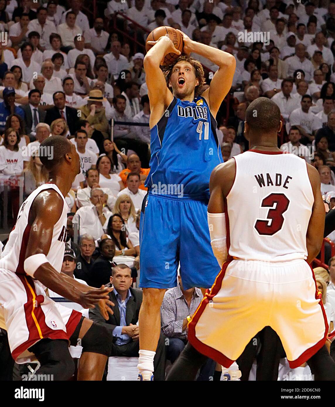Miami Heat's Dwyane Wade is fouled by Dallas Mavericks' Dirk Nowitzki in  the first half during Game 4 of the NBA Finals at the American Airlines  Arena in Miami, Florida, Thursday, June