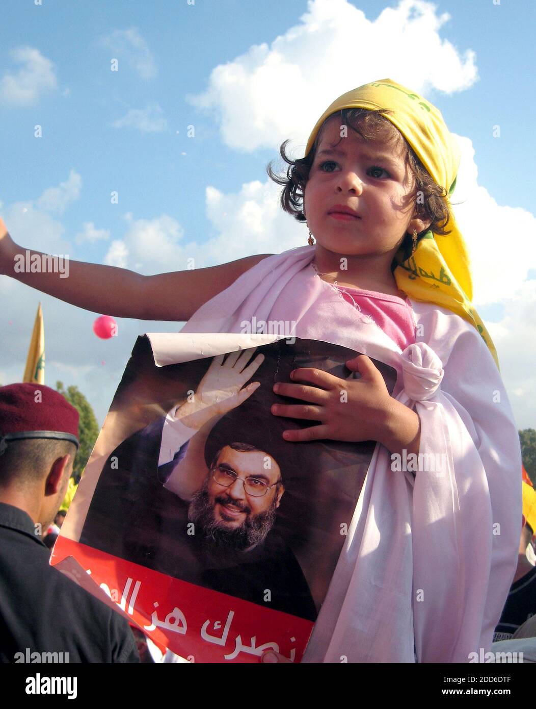 NO FILM, NO VIDEO, NO TV, NO DOCUMENTARY - A young girl his held up at a &quot;victory&quot; rally Friday, September 22, 2006, in the suburbs of Beirut for a good view of the first public appearance of Hezbollah chief Hassan Nasrallah since the war with Israel. Photo by Hannah Allam/MCT/ABACAPRESS.COM Stock Photo