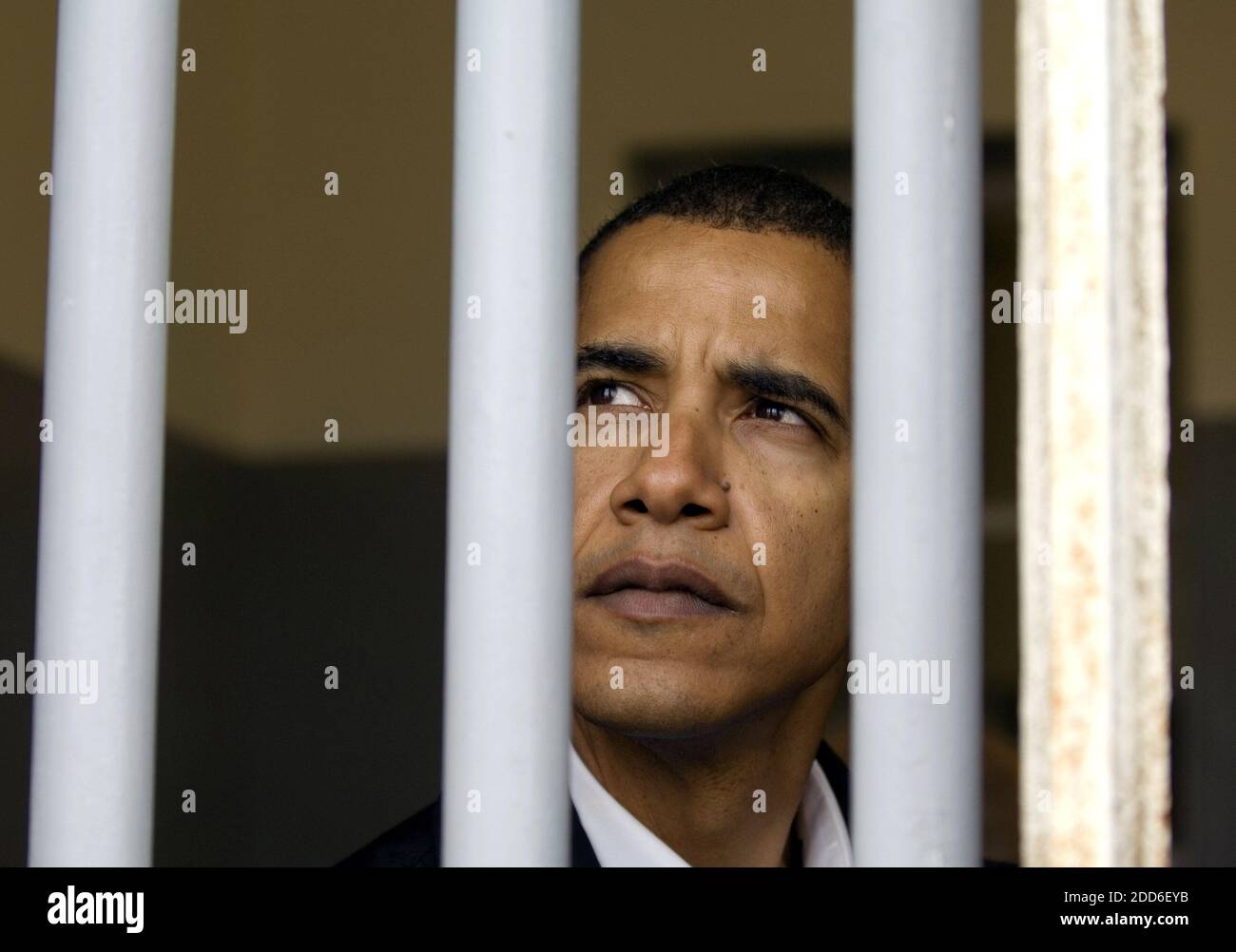 NO FILM, NO VIDEO, NO TV, NO DOCUMENTARY - Sen. Barack Obama (D-Ill.) peers out of what was Nelson Mandela's prison cell on Robben Island off the coast of Cape Town, South Africa, Sunday, August 20, 2006. Photo by Pete Souza/Chicago Tribune/MCT/ABACAPRESS.COM Stock Photo