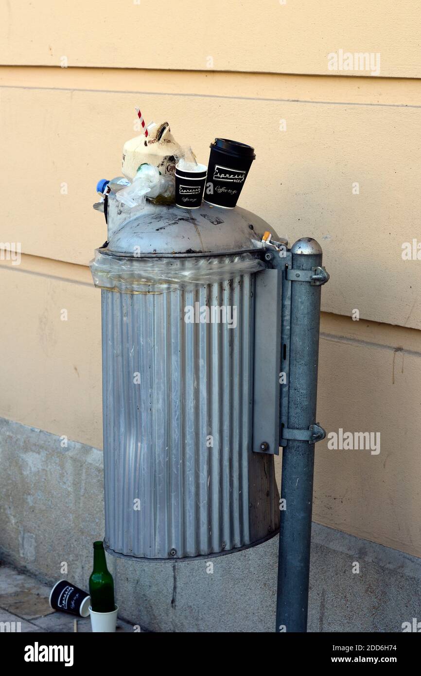 Overfilled trash can Stock Photo